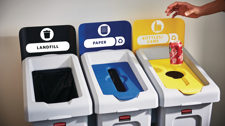 Three recycling bins labeled landfill