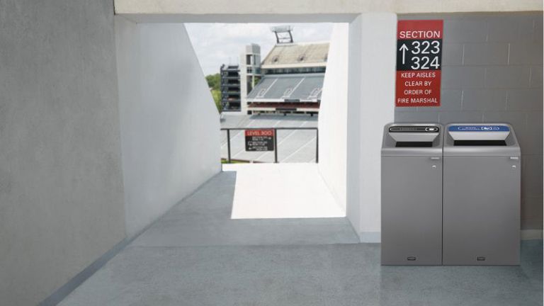 Grey hallway leading to a stadium