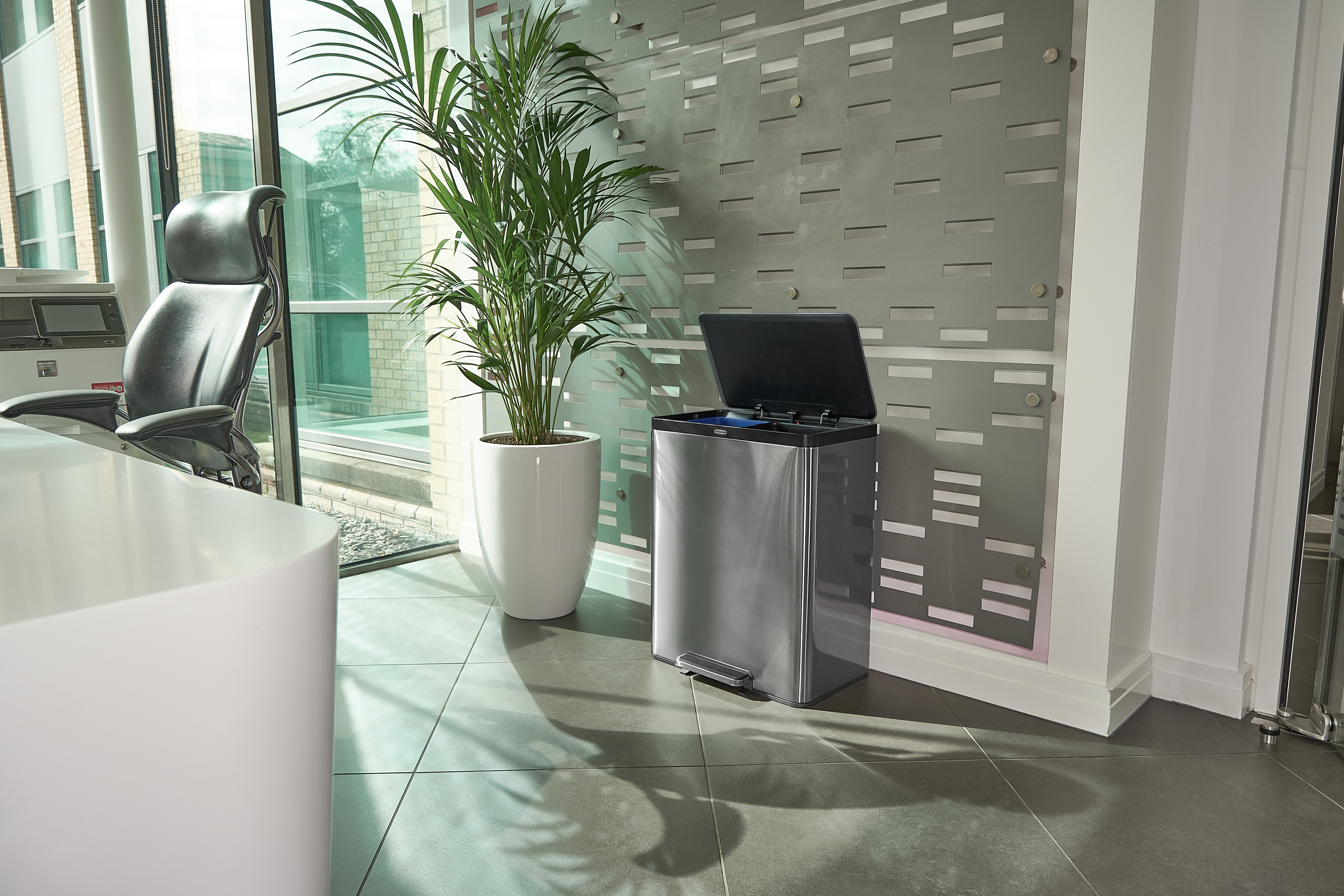 Office corner with modern black office chair