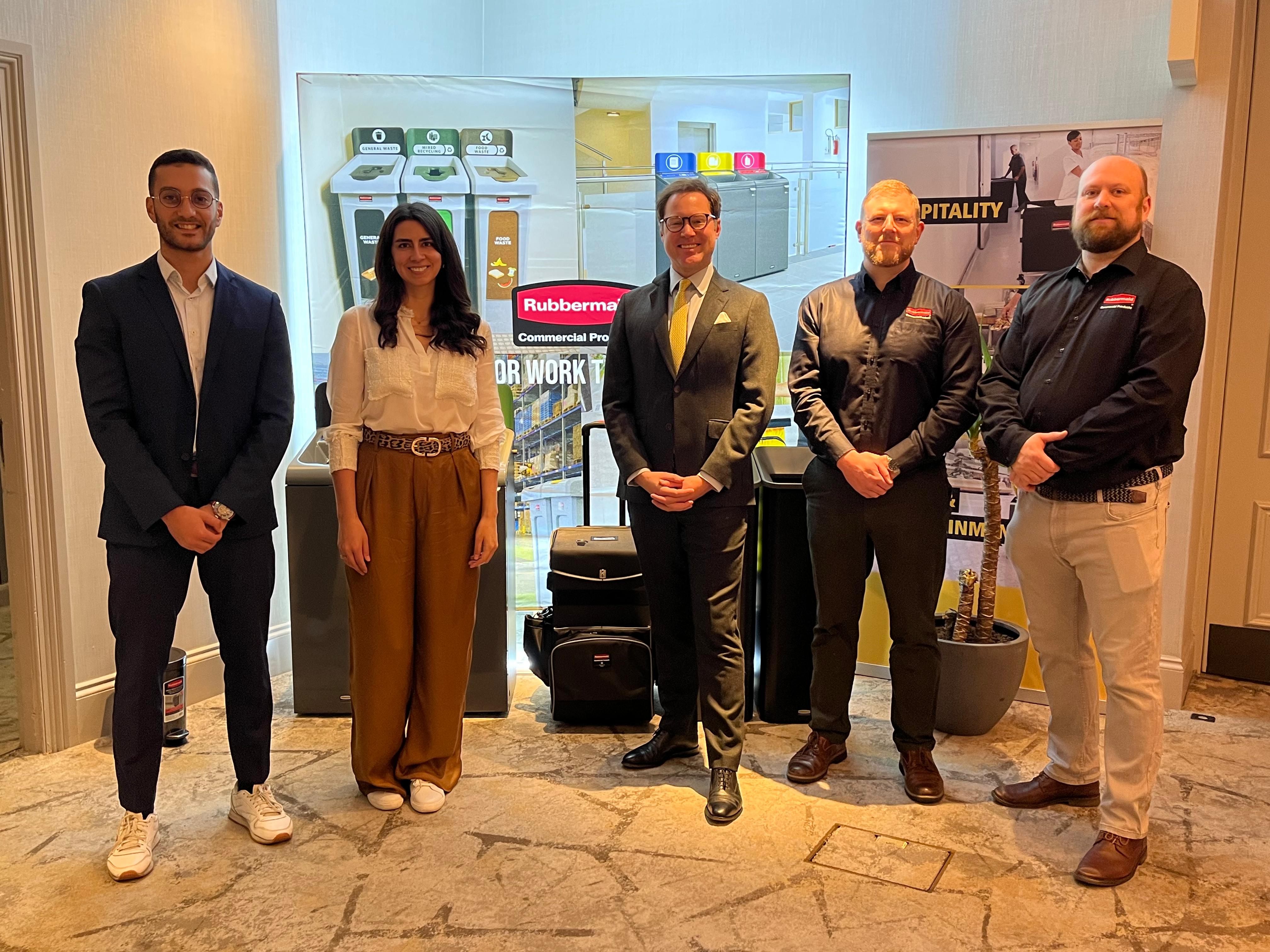 People standing in front of a modern exhibition display