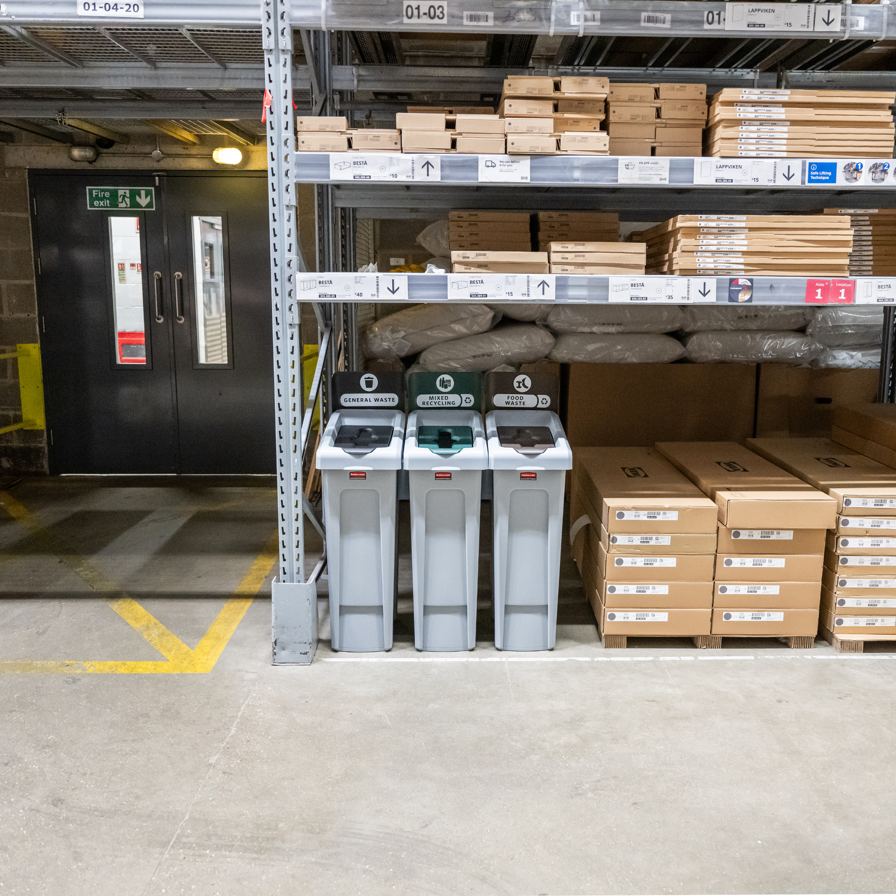 Three recycling bins labeled for general waste